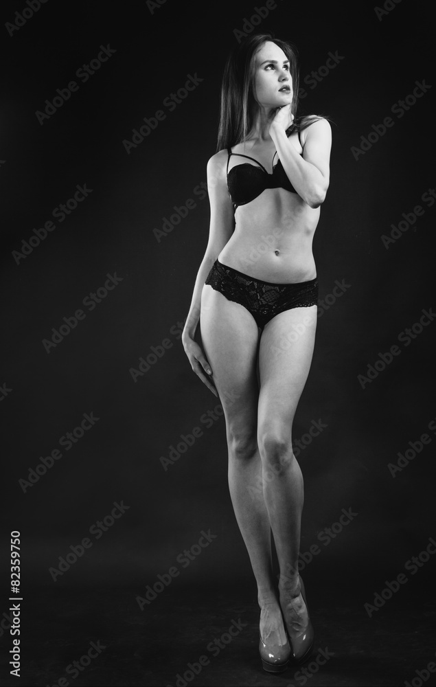 Perfect woman body on black background