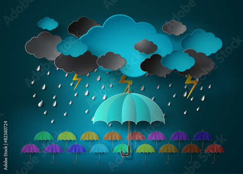 umbrella with heavy fall rain in the dark sky