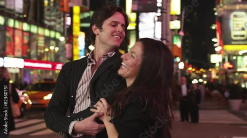 SLO MO MS Couple dancing in Times Square at night, New York City, USA