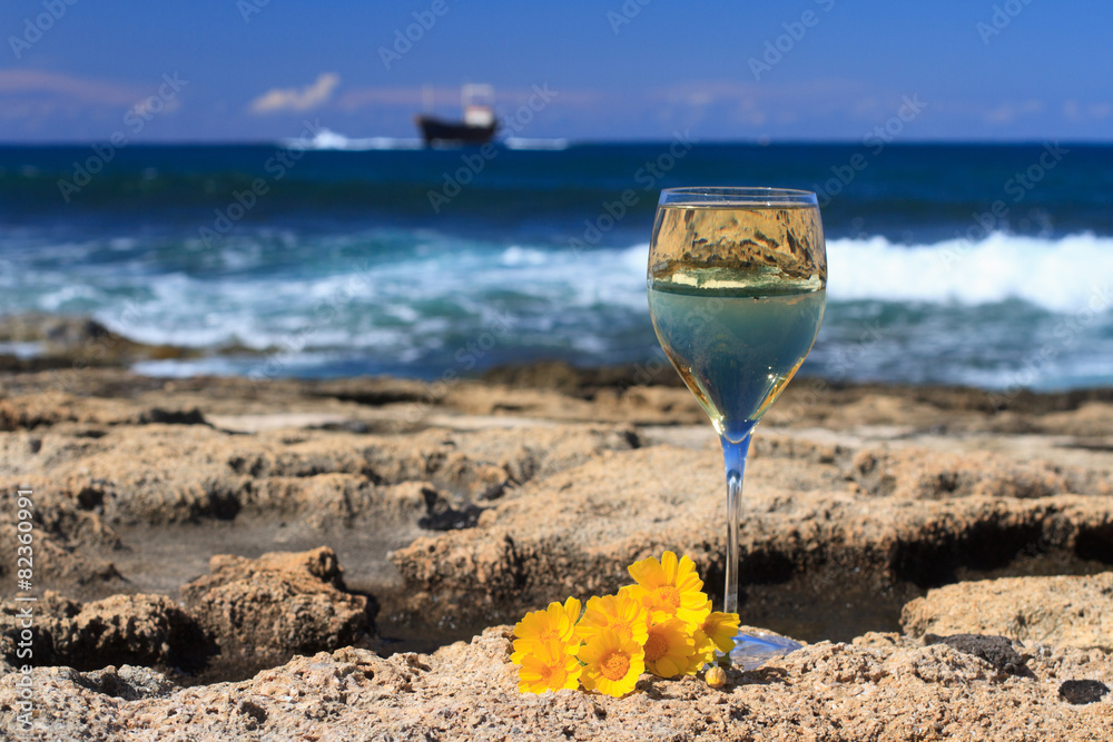 White wine closeup on a background of the sea. Horizontal
White wine closeup on a background of the sea. Horizontal