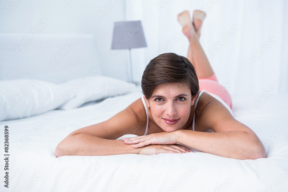 Fototapeta premium Attractive brunette smiling at camera