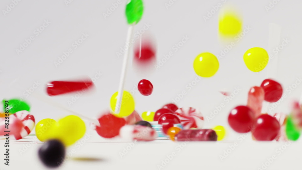 Slow motion close up shot of abundant candy falling and bouncing / Cedar Hills, Utah, United States