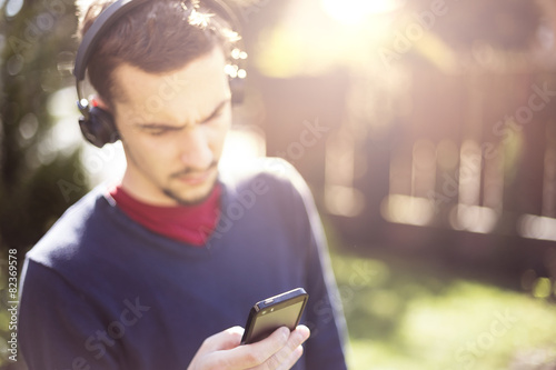 Man listening to the music with bluetooth technology