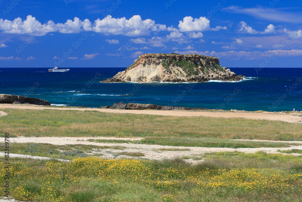 Geronisos Island near the Akamas Peninsula and pleasure ship. Cyprus, 
