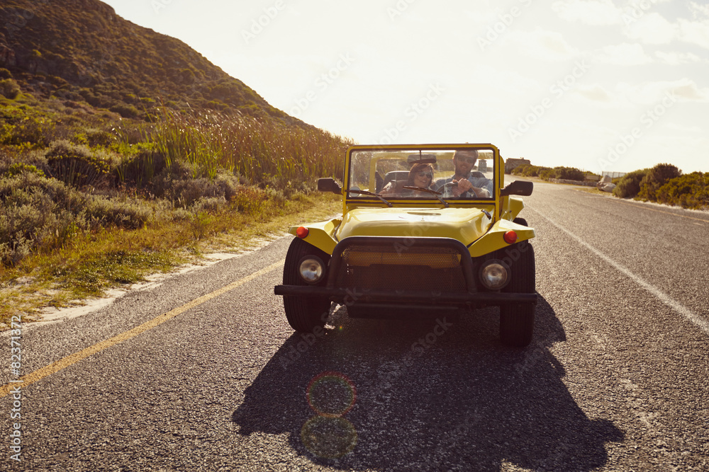 Young couple on a road trip in car Young couple on a road trip in car