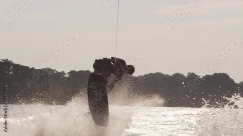 USA, Florida, Orlando, Maitland Lake. Young man on wakeboard photo