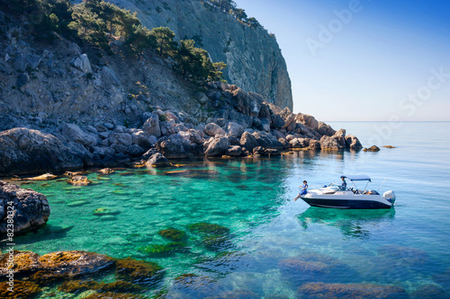 Couple traveling on the sea near the island on boat.