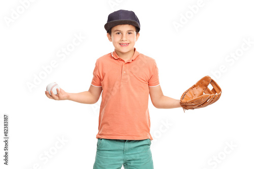 Little boy holding a baseball