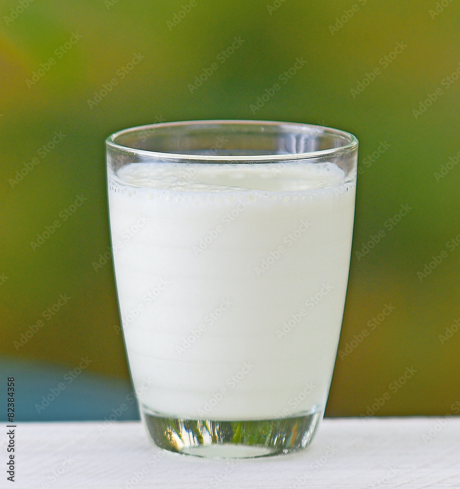 Glass of milk placed on a wooden background nature. Glass of milk placed on a wooden background nature.