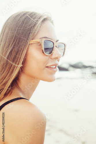 woman fresh face smiling on the beach of tropic island