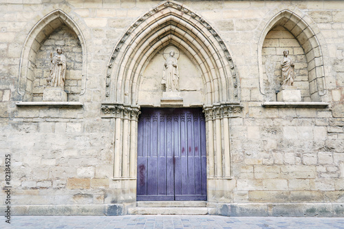 Portal in romanesque church in Reims, France. © GKor