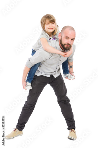 Smiling daughter on father back