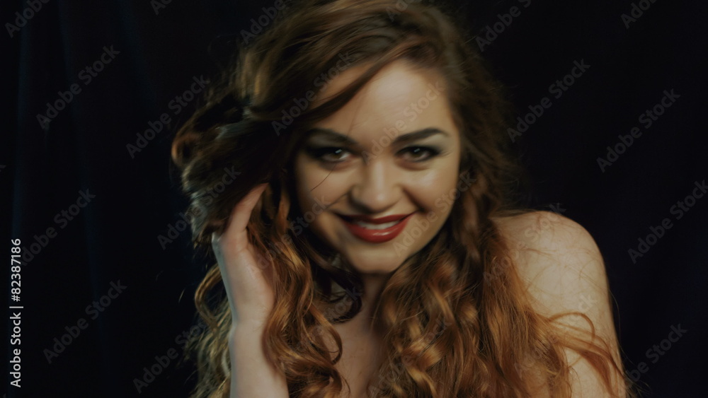 Beautiful smiling young sexy happy woman on black background Beautiful smiling young sexy happy woman on black background