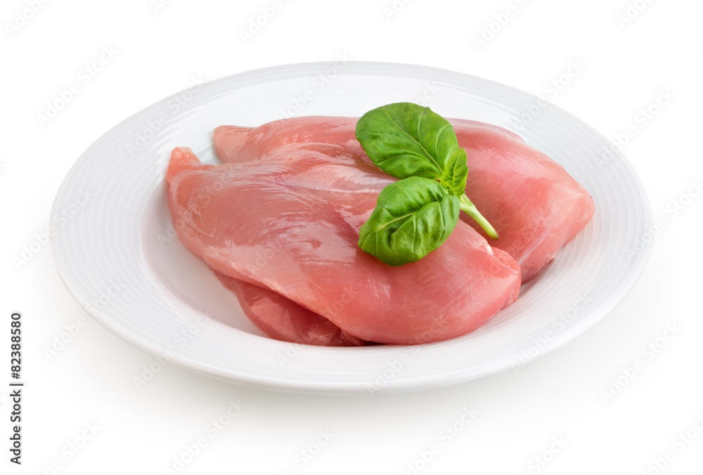 Raw fresh chicken fillet on white plate. With clipping path.