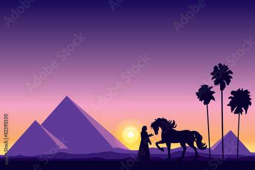 Egypt Great Pyramids with silhouette of Bedouin and horse on sun