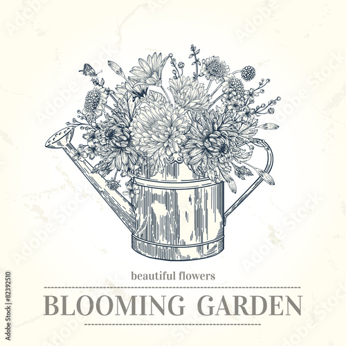 Bouquet of flowers and a copper watering can.