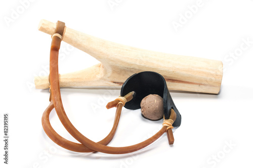 Wooden catapult slingshot isolated on white background