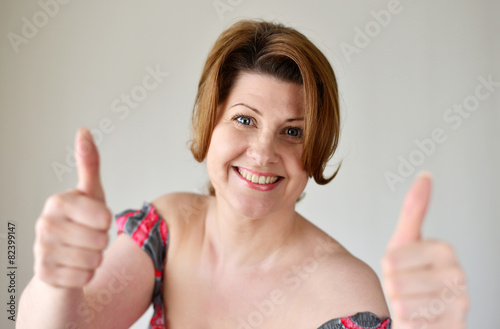 Portrait of woman showing gesture that everything is fine
