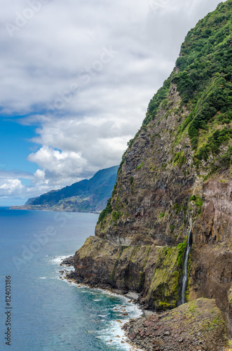 Steep northern shore of the island of Madeira, a waterfall. © a_mikhail