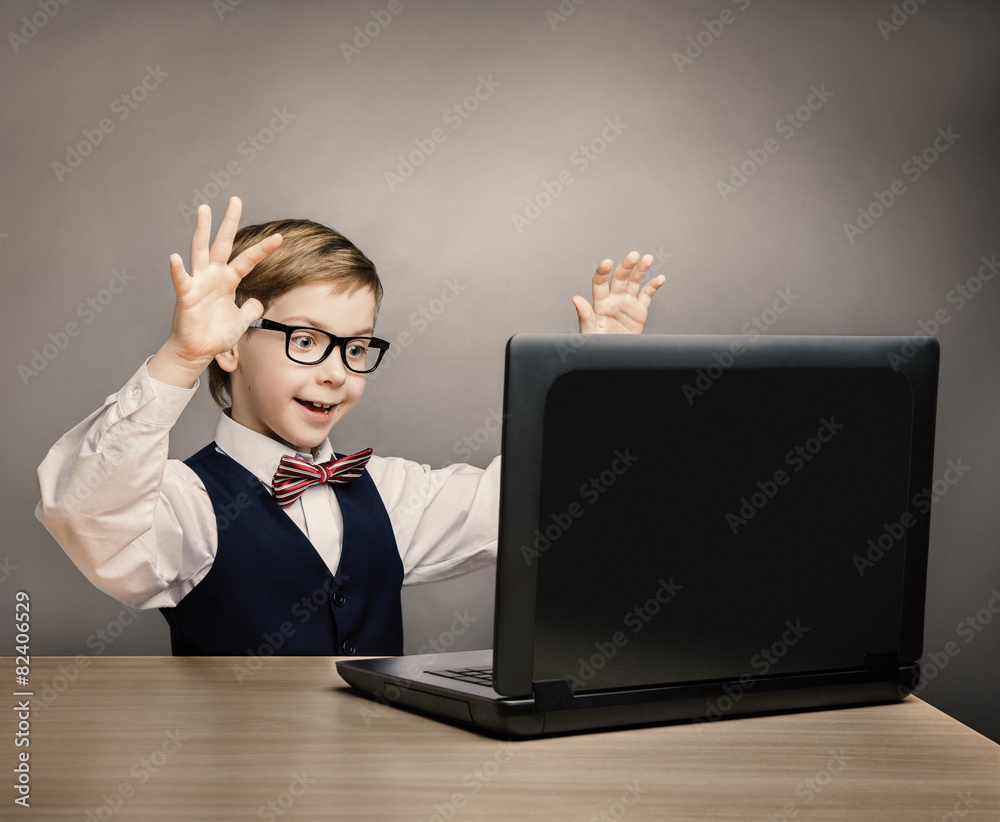 Child With Laptop, Little Boy in Glasses Looking at Computer Child With Laptop, Little Boy in Glasses Looking at Computer