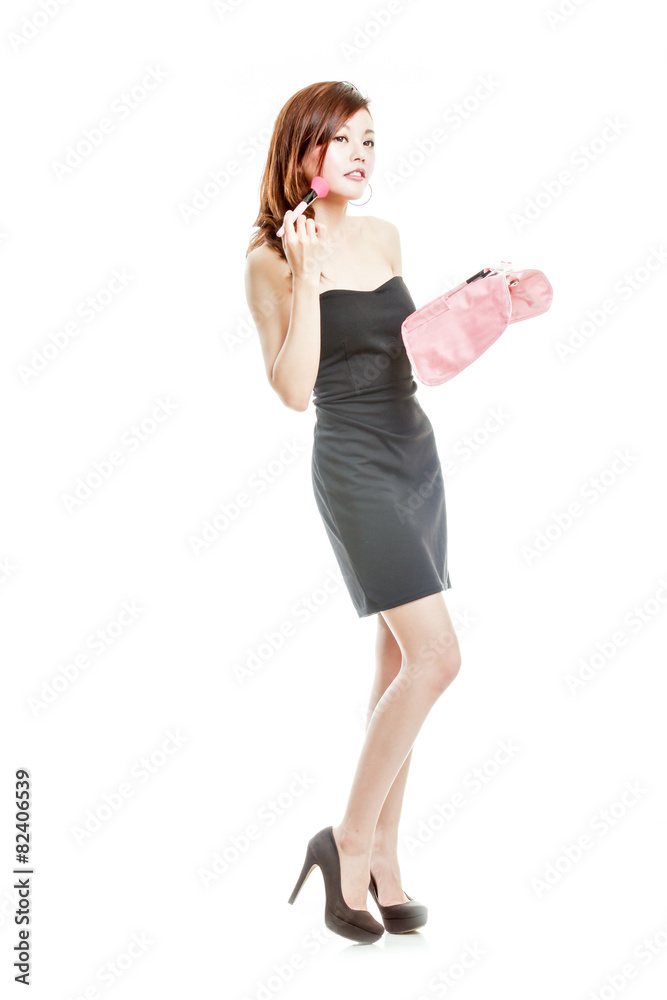 Fototapeta premium Attractive Asian woman applying make-up