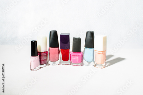 Group of bright nail polishes isolated on white © pelagey18