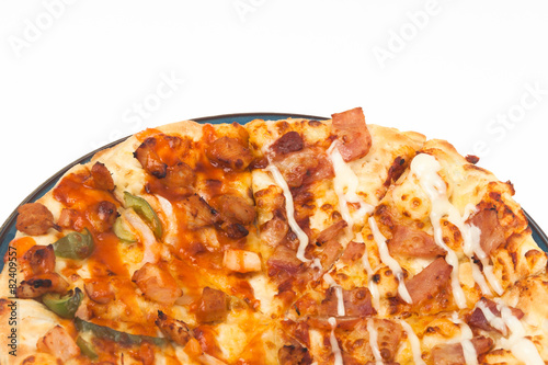 round pizza on blue dish isolated