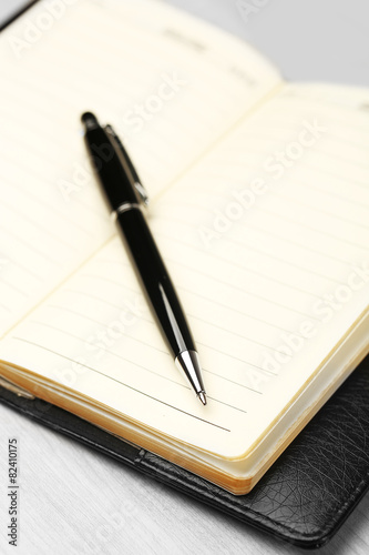 Wallpaper Mural Writing pen and notebook on wooden table, closeup Torontodigital.ca