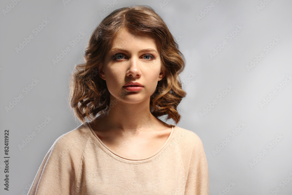 Portrait of beautiful model on gray background Portrait of beautiful model on gray background