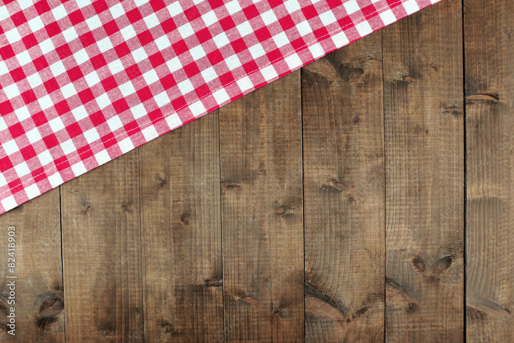 Checkered napkin on wooden table background Checkered napkin on wooden table background