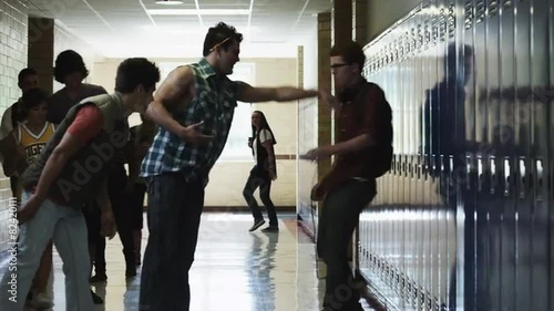 MS Student bullying friends (14-17) in school corridor / Spanish Fork City, Utah, USA