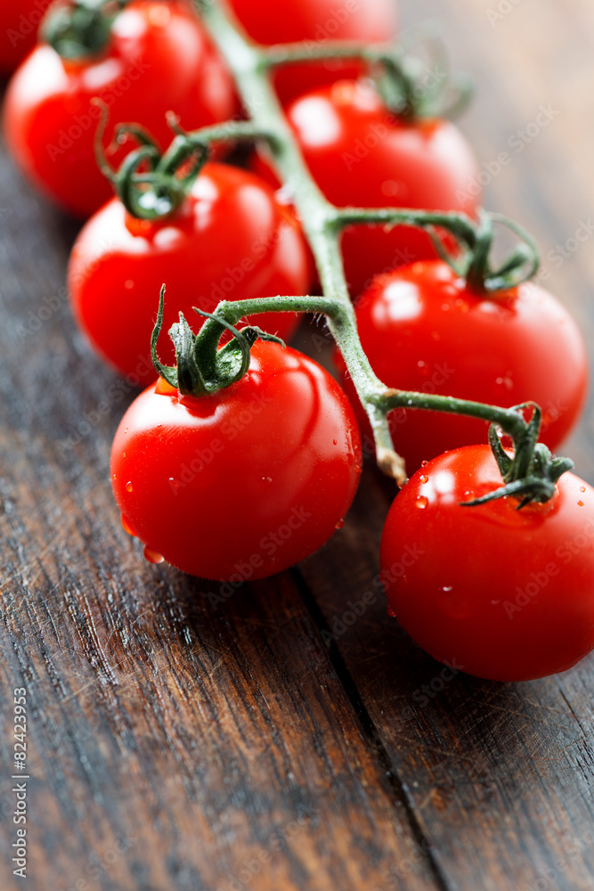 Tomatoes on vein vertical Tomatoes on vein vertical