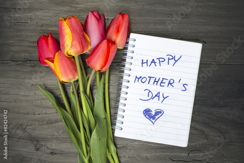 tulip bouquet and notepad with words "happy mother's day"