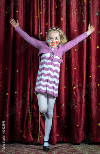 Young girl making her entrance on stage