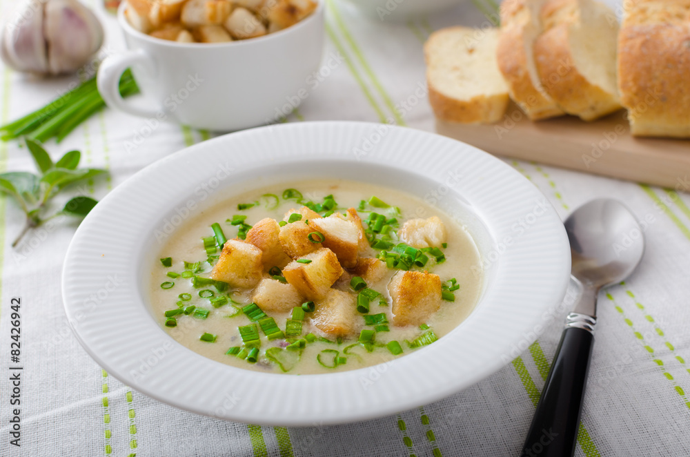 Garlic soup with croutons, spring onions and chives Garlic soup with croutons, spring onions and chives
