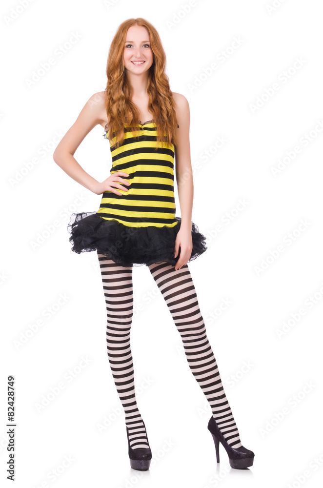 A girl in black and yellow striped dress isolated on white A girl in black and yellow striped dress isolated on white