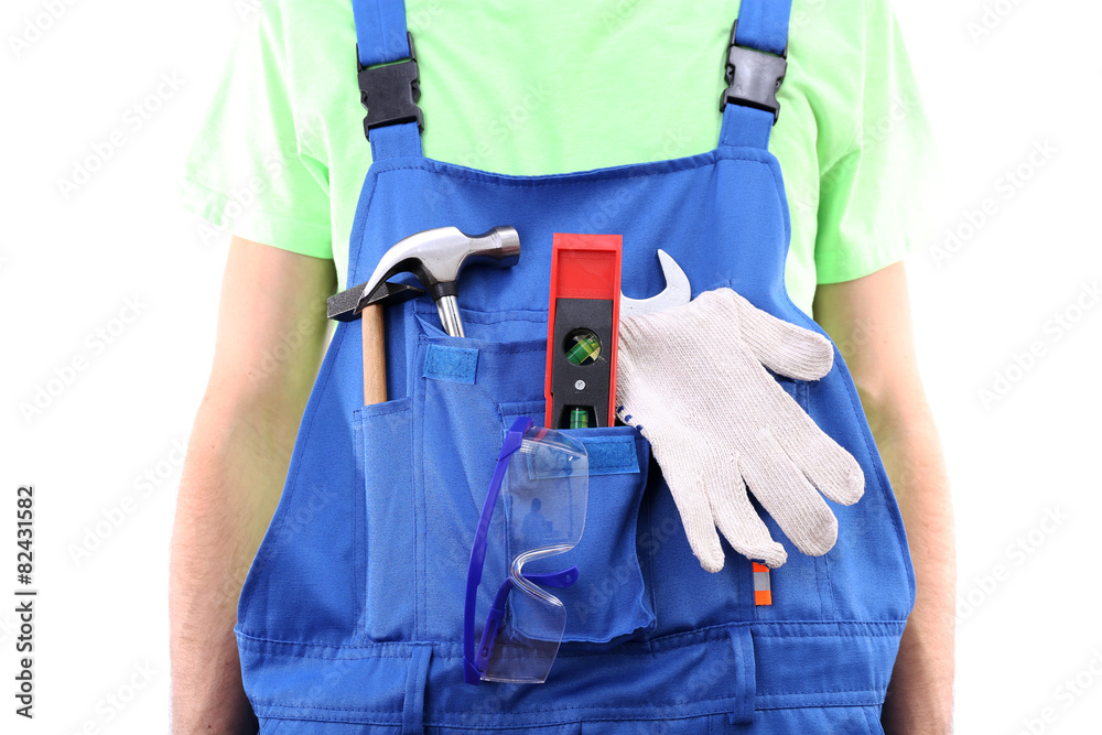 Man in coveralls with tools in his pocket isolated on white Man in coveralls with tools in his pocket isolated on white