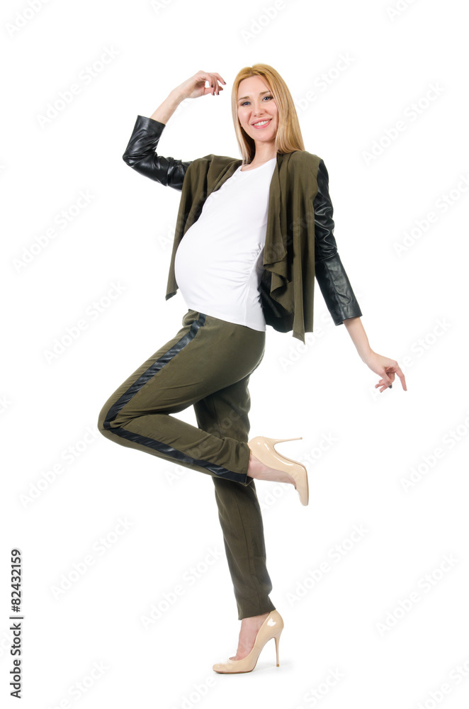 Pregnant woman in fashionable costume isolated on white