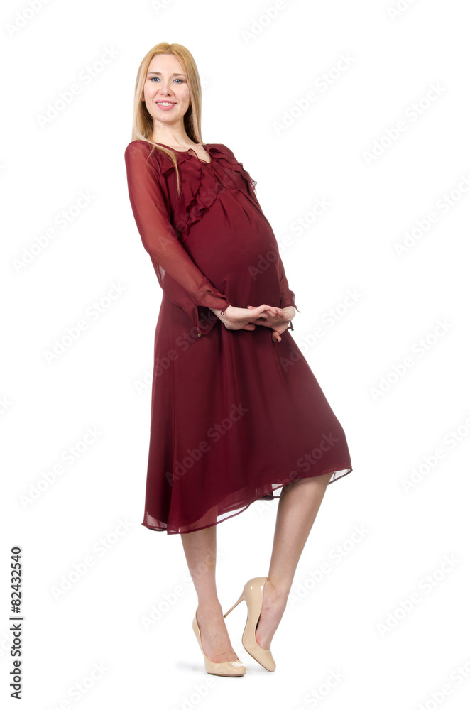 Pretty pregnant woman in red dress isolated on white