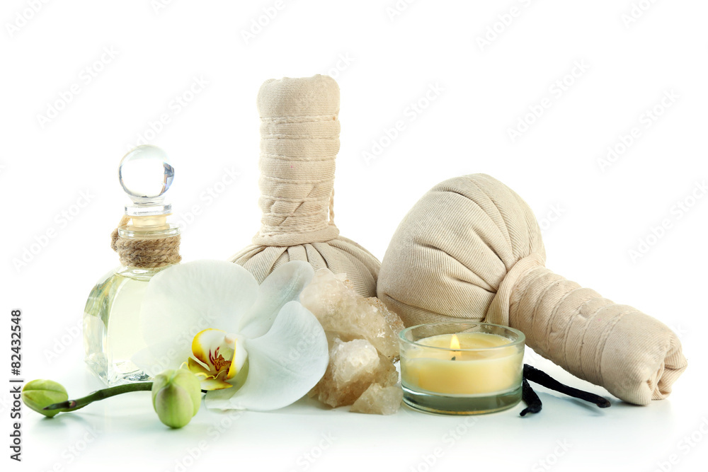 Composition with massage bags, sea salt and orchid flower, isolated on white Composition with massage bags, sea salt and orchid flower, isolated on white