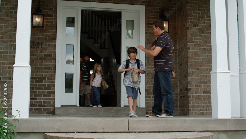 father watching children leave for school father watching children leave for school