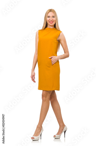 Pretty girl in ocher dress isolated on white