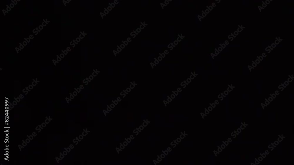 A looping clip of embers blowing upward on a dark night. A looping clip of embers blowing upward on a dark night.