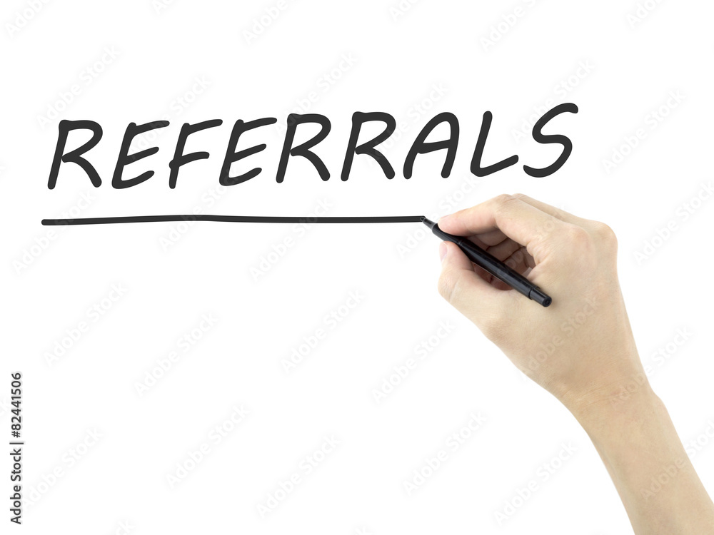 referrals word written by man's hand referrals word written by man's hand