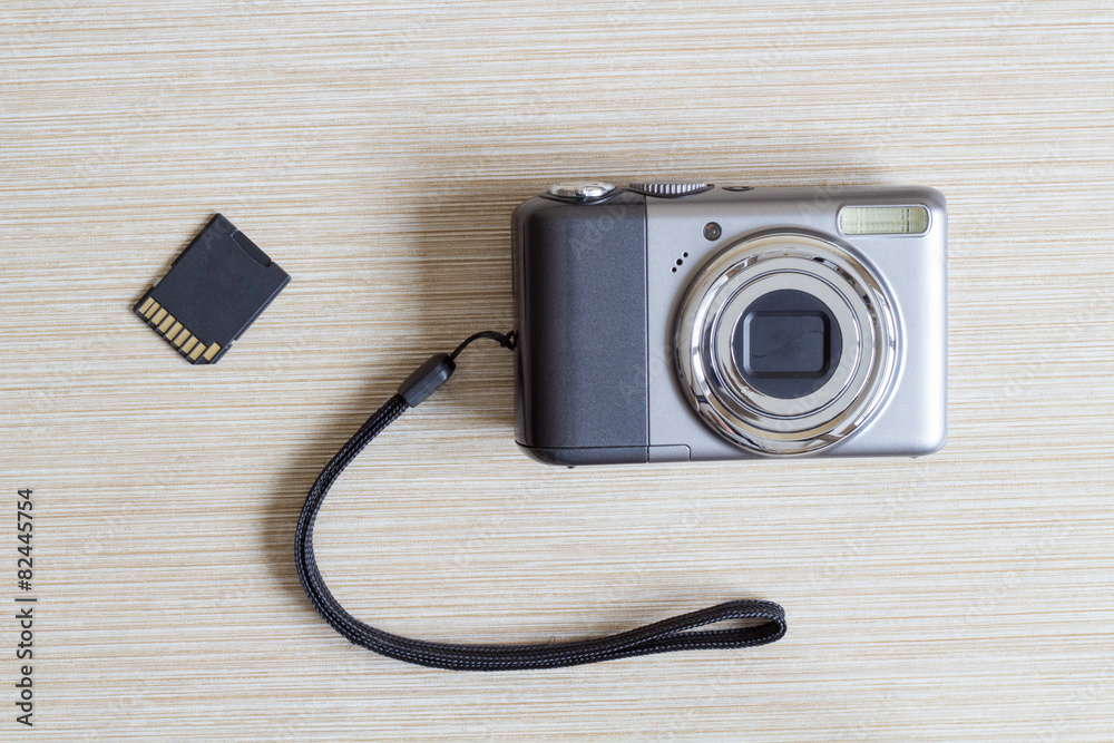 Digital photo camera and SD card.
