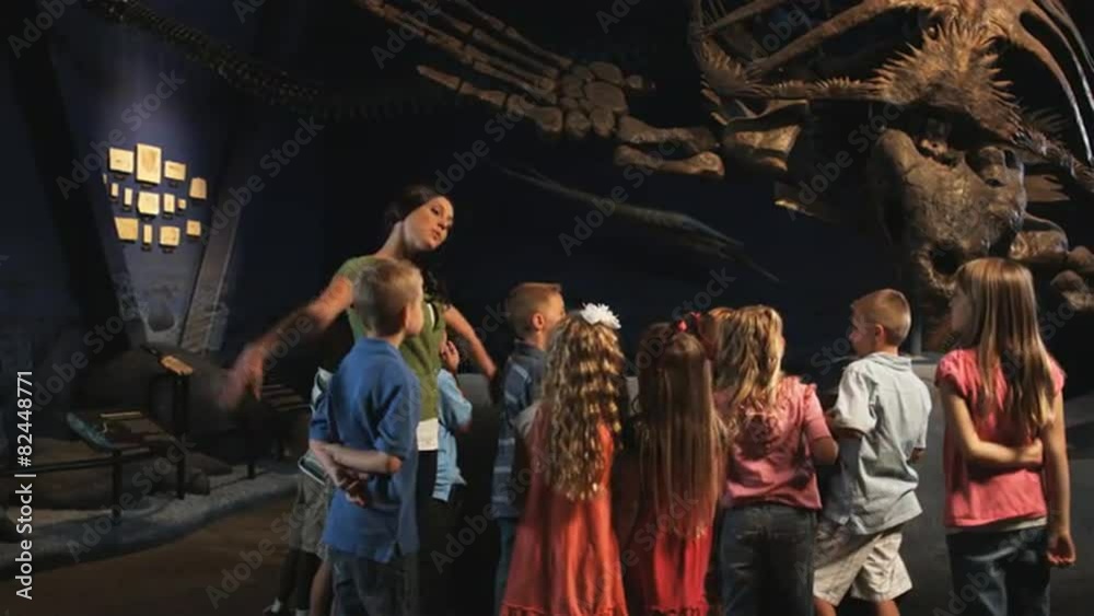 MS Young woman with group of children (4-5, 6-7, 8-9) in natural history museum, Lehi, Utah, USA MS Young woman with group of children (4-5, 6-7, 8-9) in natural history museum, Lehi, Utah, USA