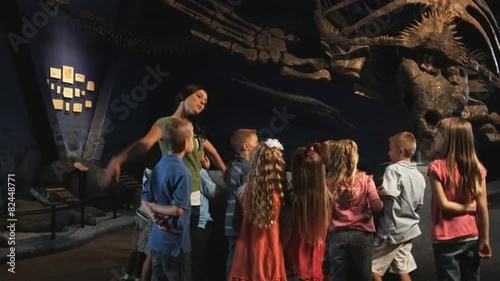 Wallpaper Mural MS Young woman with group of children (4-5, 6-7, 8-9) in natural history museum, Lehi, Utah, USA Torontodigital.ca