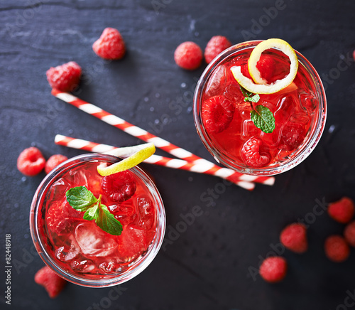 rwo raspberry cocktails with retro straws shot top down photo