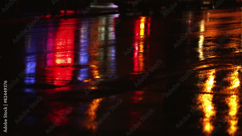 CU City lights reflected in wet street at night, New York City, New York, USA CU City lights reflected in wet street at night, New York City, New York, USA