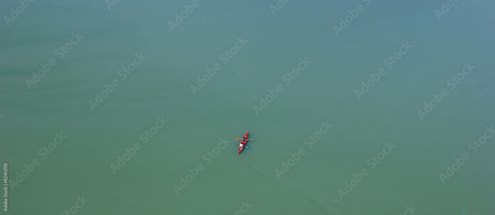 Look down on to the canoe in calm lake